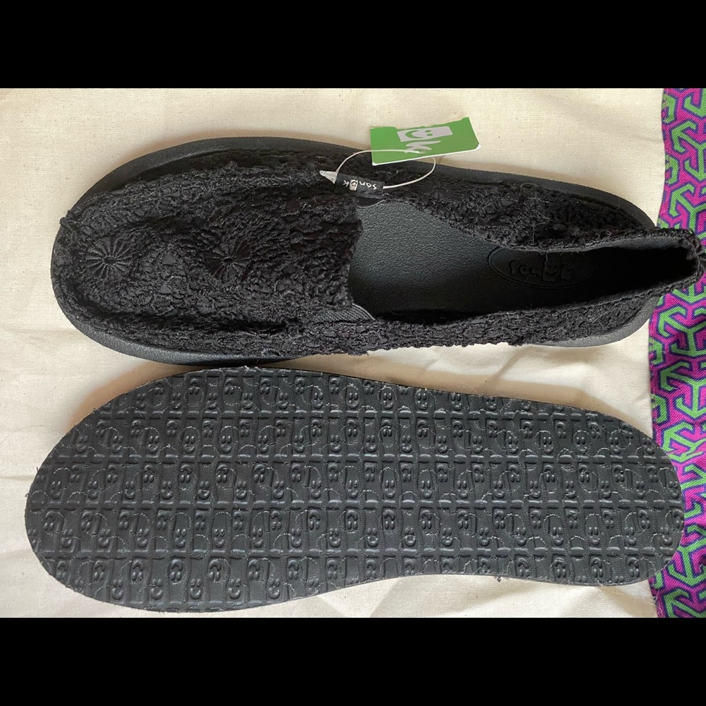 All black flower design brand new sanuks!